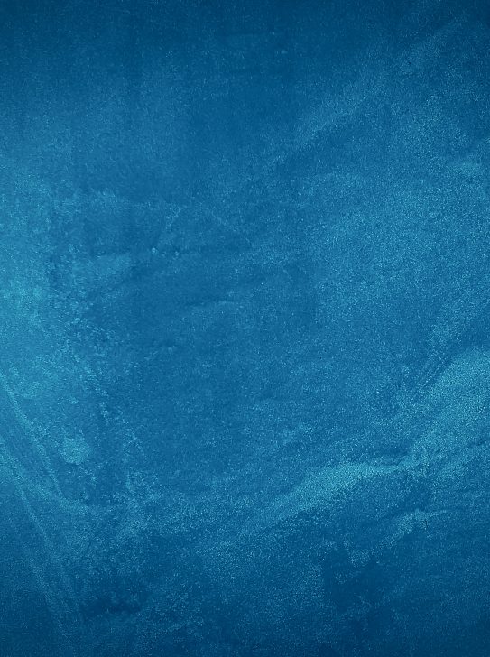 Vintage grunge blue concrete texture studio wall background with vignette. Vintage grunge blue concrete texture studio wall background with vignette